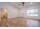 Bright and airy living room with wood-look floors at 13050 Ne 7Th Loop, Silver Springs, FL 34488