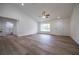 Large living room with lots of natural light, wood-look floors and an open, airy feel at 13050 Ne 7Th Loop, Silver Springs, FL 34488
