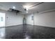 Spacious garage with epoxy flooring and overhead door at 600 Ne 130Th Ter, Silver Springs, FL 34488