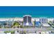 Stunning aerial view of a beachfront condominium complex with ocean views and easy beach access at 89 S Atlantic Ave # 204, Ormond Beach, FL 32176
