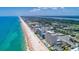 Aerial view of coastline with ocean and buildings at 89 S Atlantic Ave # 204, Ormond Beach, FL 32176