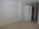 Empty carpeted bedroom with white walls at 89 S Atlantic Ave # 204, Ormond Beach, FL 32176