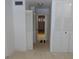 Hallway with multiple closet doors and carpeted floor at 89 S Atlantic Ave # 204, Ormond Beach, FL 32176