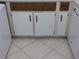 White kitchen cabinets with dark brown countertops at 89 S Atlantic Ave # 204, Ormond Beach, FL 32176