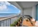 Virtually staged balcony boasts stunning ocean views and outdoor grill at 89 S Atlantic Ave # 204, Ormond Beach, FL 32176