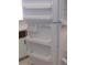 White refrigerator with multiple shelves and drawers at 89 S Atlantic Ave # 204, Ormond Beach, FL 32176