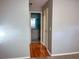 View of bathroom with vanity and wood-look floors at 10730 Se 50Th Ave, Belleview, FL 34420