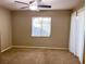 Bedroom with carpeted floors, ceiling fan, and window coverings at 10730 Se 50Th Ave, Belleview, FL 34420