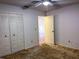 Bedroom with double door closet and carpet flooring at 10730 Se 50Th Ave, Belleview, FL 34420