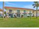 Backyard view of units with patios, balcony, and waterfront views at 14 Ocean Palm Villa S # 14, Flagler Beach, FL 32136