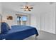 Comfortable bedroom featuring a serene water view, ceiling fan, and ample closet space at 14 Ocean Palm Villa S # 14, Flagler Beach, FL 32136