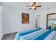 Bedroom with painted horse art and a wide mirror showing a window with a beautiful view at 14 Ocean Palm Villa S # 14, Flagler Beach, FL 32136
