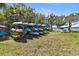 Colorful kayaks are neatly racked on the waterside grounds, next to a picnic table at 14 Ocean Palm Villa S # 14, Flagler Beach, FL 32136