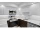 Modern kitchen featuring stainless steel appliances, white countertops, and sleek white cabinetry for a clean look at 14 Ocean Palm Villa S # 14, Flagler Beach, FL 32136