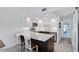 Well-lit kitchen showcasing a spacious island with seating, stainless steel appliances, and a modern design at 14 Ocean Palm Villa S # 14, Flagler Beach, FL 32136