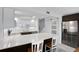 Bright kitchen with sleek white cabinets, stainless steel appliances, and a large center island with seating at 14 Ocean Palm Villa S # 14, Flagler Beach, FL 32136