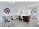 Open-concept kitchen with white cabinets, stainless steel appliances, and a center island with barstool seating at 14 Ocean Palm Villa S # 14, Flagler Beach, FL 32136