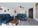 Inviting living room with hardwood floors and nautical decor, seamlessly flowing into a modern, updated kitchen at 14 Ocean Palm Villa S # 14, Flagler Beach, FL 32136