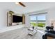 Bright living room with contemporary furniture, built-in shelving, and scenic river views through sliding glass doors at 14 Ocean Palm Villa S # 14, Flagler Beach, FL 32136