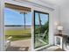 The sliding glass door opens up to the lanai, providing a seamless transition to indoor-outdoor living at 14 Ocean Palm Villa S # 14, Flagler Beach, FL 32136