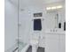 White tiled shower with mosaic tile floor, modern fixture, and relaxing space at 14 Ocean Palm Villa S # 14, Flagler Beach, FL 32136