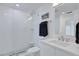 Shower with glass door, white tiles and stylish mosaic tile floor, and a view of the sink at 14 Ocean Palm Villa S # 14, Flagler Beach, FL 32136