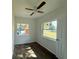 Well-lit bedroom featuring wood-look floors and dual windows at 930 Nw 6Th Terrace Ter, Ocala, FL 34475