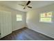 Bedroom with wood-look floors and ceiling fan at 930 Nw 6Th Terrace Ter, Ocala, FL 34475