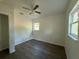 Spacious bedroom with wood-look floors and ceiling fan at 930 Nw 6Th Terrace Ter, Ocala, FL 34475