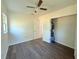 Bright bedroom with wood-look floors and ample closet space at 930 Nw 6Th Terrace Ter, Ocala, FL 34475