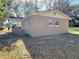 Rear view of a newly constructed light brown single-story house at 930 Nw 6Th Terrace Ter, Ocala, FL 34475