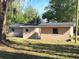 Rear view of a newly constructed light brown single-story house at 930 Nw 6Th Terrace Ter, Ocala, FL 34475