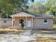 Newly constructed light brown single-story house with covered porch at 930 Nw 6Th Terrace Ter, Ocala, FL 34475