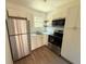 Modern kitchen featuring stainless steel appliances and white cabinets at 930 Nw 6Th Terrace Ter, Ocala, FL 34475