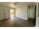 Bright living room with wood-look floors and access to backyard at 930 Nw 6Th Terrace Ter, Ocala, FL 34475