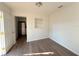 Living room with wood-look floors and kitchen views at 930 Nw 6Th Terrace Ter, Ocala, FL 34475