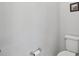 Small bathroom with toilet and wall-mounted fixtures at 6043 Sw 93Rd Cir, Ocala, FL 34481