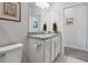 Bathroom with single vanity, granite countertop, and toilet at 6043 Sw 93Rd Cir, Ocala, FL 34481