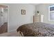 Bedroom with dresser, queen-size bed, and access to bathroom at 6043 Sw 93Rd Cir, Ocala, FL 34481