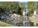 Stone Creek community entrance with water feature and landscaping at 6043 Sw 93Rd Cir, Ocala, FL 34481