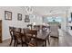 Bright dining room with wood table and chairs, hardwood floors at 6043 Sw 93Rd Cir, Ocala, FL 34481