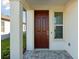 Exterior front door with sidelight window at 6043 Sw 93Rd Cir, Ocala, FL 34481