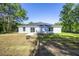 View of back of home with a spacious backyard at 8873 Sw 139Th Place Rd, Ocala, FL 34473