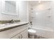 Bathroom with granite countertop and bathtub at 8873 Sw 139Th Place Rd, Ocala, FL 34473