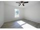 Bright bedroom with sleek ceiling fan and luxury vinyl plank flooring at 8873 Sw 139Th Place Rd, Ocala, FL 34473