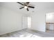 Well-lit bedroom has vinyl floors, fresh paint, and an adjacent bathroom for a private retreat at 8873 Sw 139Th Place Rd, Ocala, FL 34473