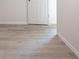 Detailed view of the new vinyl floors, baseboards, and fresh paint in this bedroom at 8873 Sw 139Th Place Rd, Ocala, FL 34473