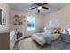 Bedroom with full bed, shelves, and window at 8873 Sw 139Th Place Rd, Ocala, FL 34473