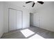 Bedroom features neutral walls, luxury vinyl plank flooring, and closet at 8873 Sw 139Th Place Rd, Ocala, FL 34473
