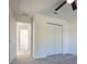 Bedroom features closet, doors, vinyl flooring, and is ready for your personal design at 8873 Sw 139Th Place Rd, Ocala, FL 34473
